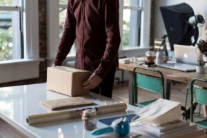 A small e-commerce store owner packing products from home to represent SEO mistakes made be e-commerce shops in South Africa.