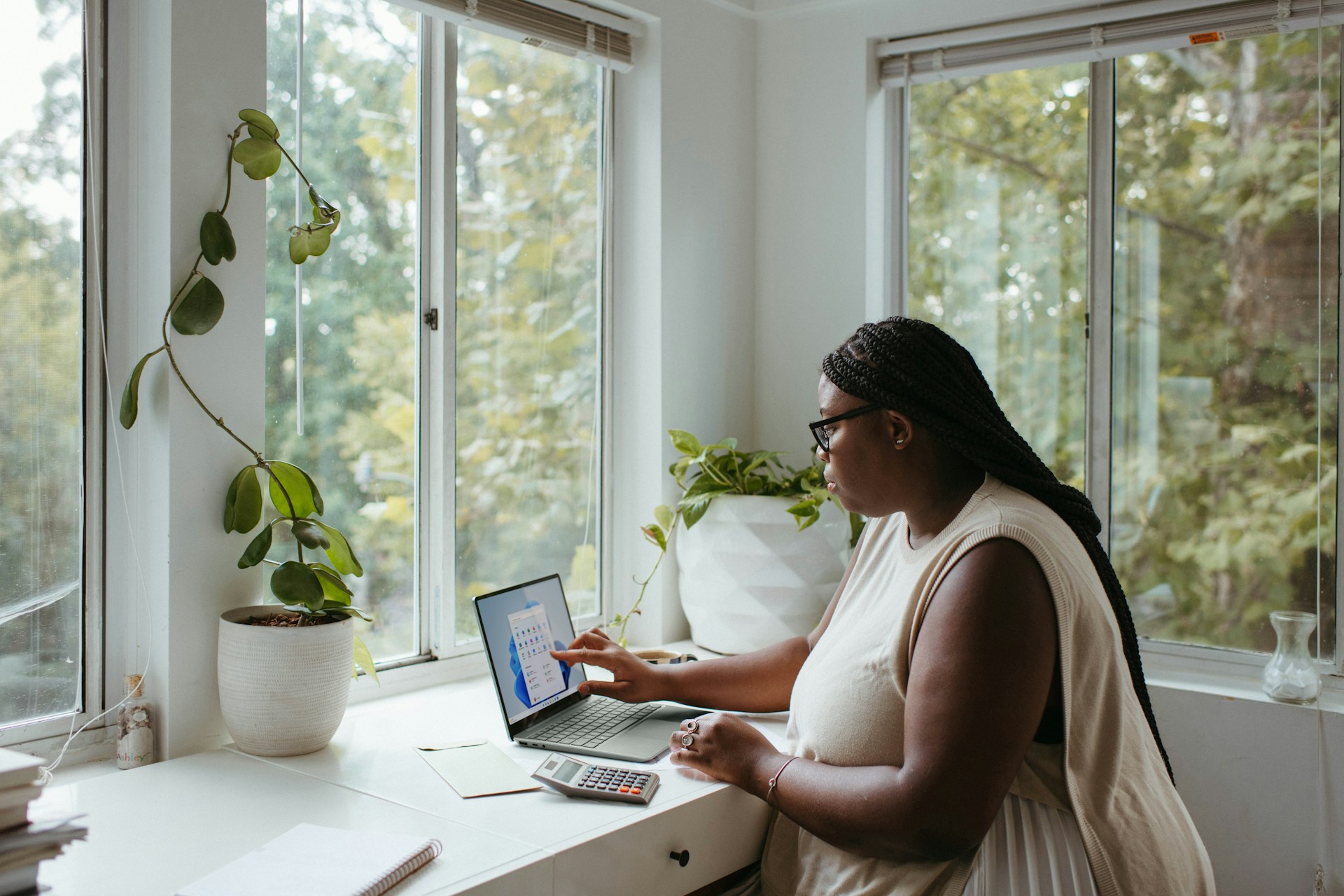 A South African woman sitting at home to create an online store.